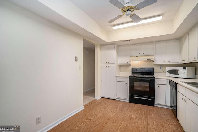 kitchen with ceiling fan, black appliances, light wood-type flooring, and white cabinetry