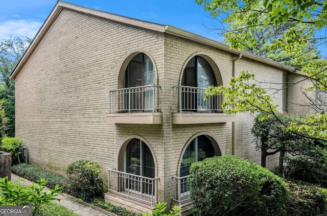 back of property with a balcony