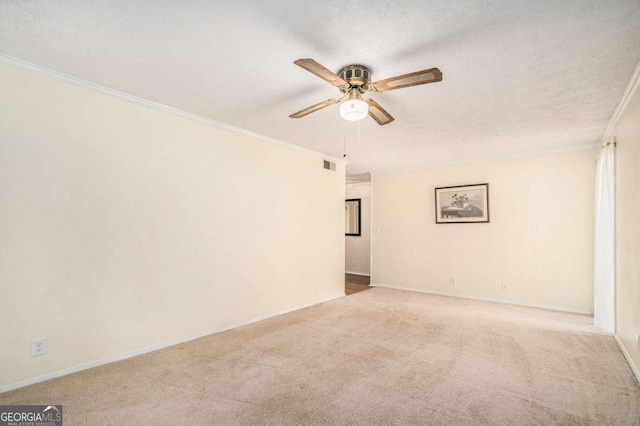 unfurnished room with ceiling fan, light colored carpet, and a textured ceiling