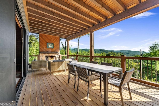 wooden deck featuring a mountain view