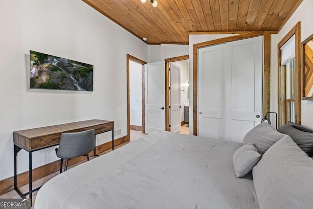 bedroom with wooden ceiling, vaulted ceiling, and a closet