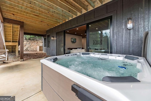 exterior space with a hot tub