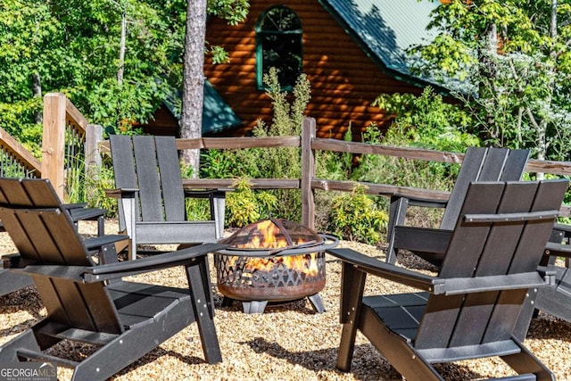 view of patio featuring an outdoor fire pit