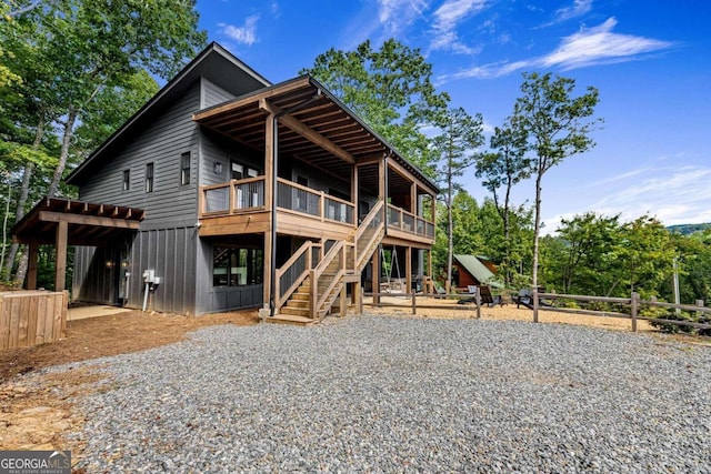 back of property featuring a playground