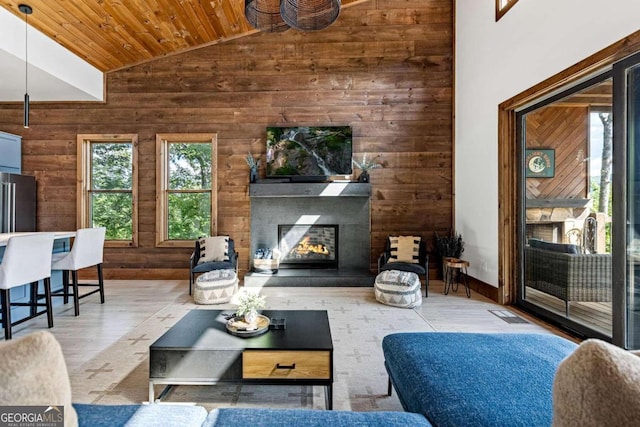 living room featuring wooden ceiling, vaulted ceiling, hardwood / wood-style floors, and wood walls