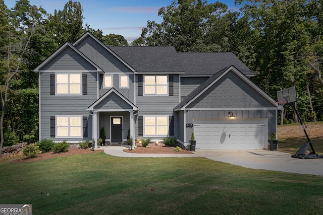 view of front facade featuring a garage and a lawn