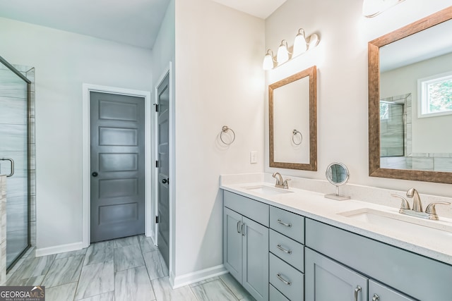 bathroom with vanity and a shower with shower door