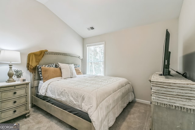 carpeted bedroom featuring lofted ceiling