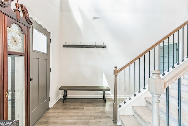 entryway with hardwood / wood-style floors