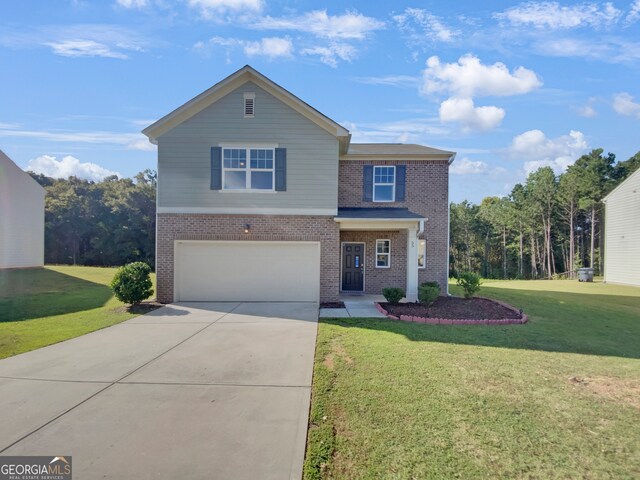 view of front of home featuring a front lawn and a garage