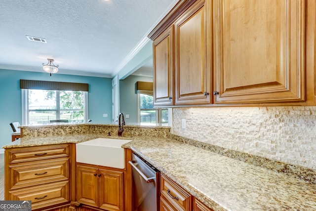 kitchen with dishwasher, backsplash, crown molding, sink, and light stone counters