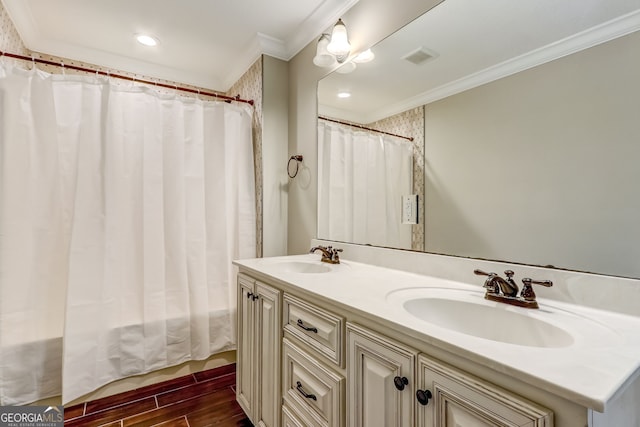 bathroom featuring hardwood / wood-style floors, shower / bathtub combination with curtain, crown molding, and vanity