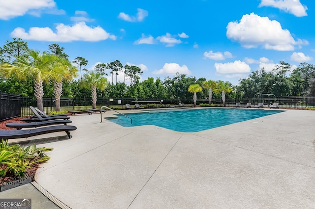 view of swimming pool with a patio area