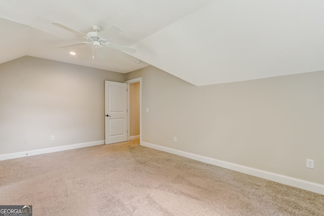 bonus room featuring light carpet, vaulted ceiling, and ceiling fan