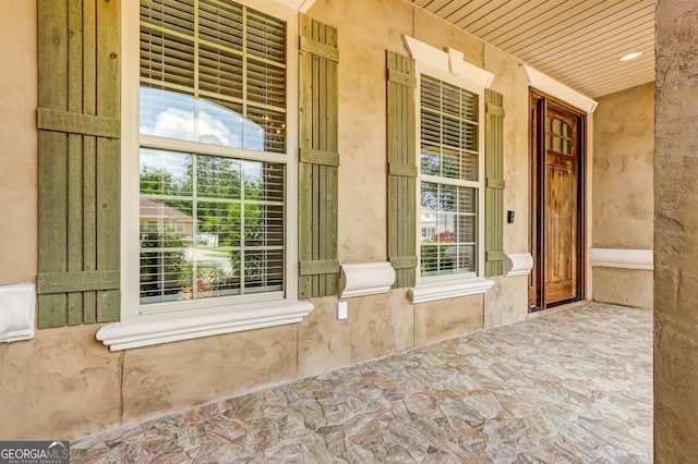 entrance to property featuring a porch