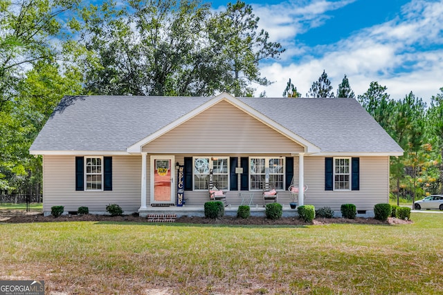 ranch-style home featuring a front lawn