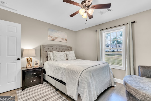 bedroom with ceiling fan and light wood-type flooring