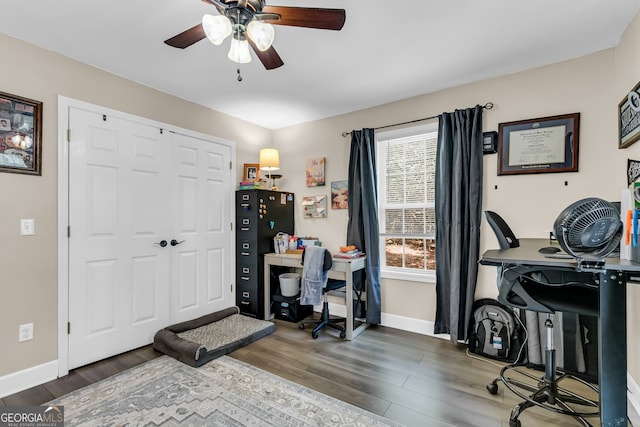 office space with ceiling fan and dark hardwood / wood-style floors