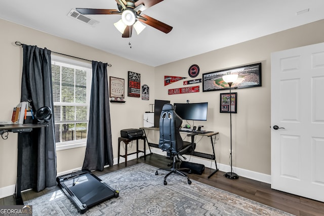 office area featuring dark hardwood / wood-style flooring and ceiling fan