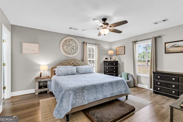 bedroom with ceiling fan and hardwood / wood-style flooring