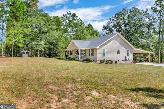 ranch-style home with a front yard, a carport, and a porch