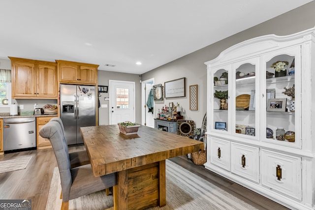 dining area with hardwood / wood-style flooring