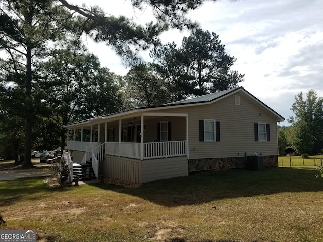 exterior space featuring a front yard and covered porch