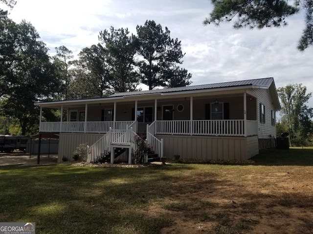 view of front of home with a porch and a front lawn