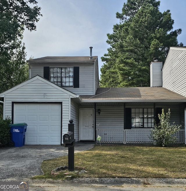 602 Pine Tree Trl, College Park, GA 30349 - traditional-style home with gravel driveway, a porch, roof with shingles, a front yard, and a garage