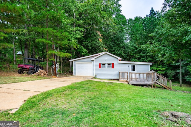 view of front of home with a garage, a deck, and a front lawn