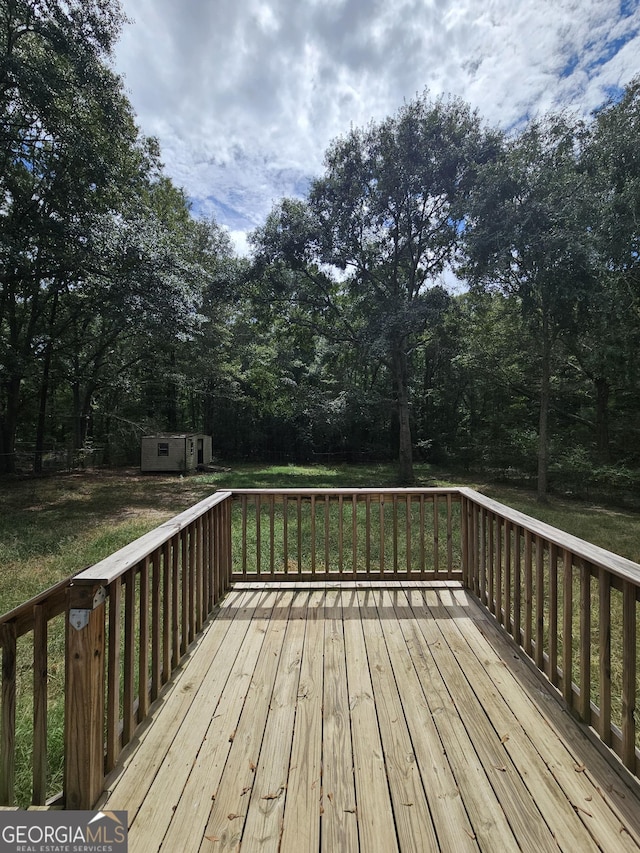 wooden terrace with a storage unit