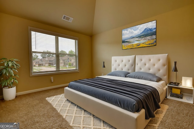 bedroom featuring vaulted ceiling and carpet floors