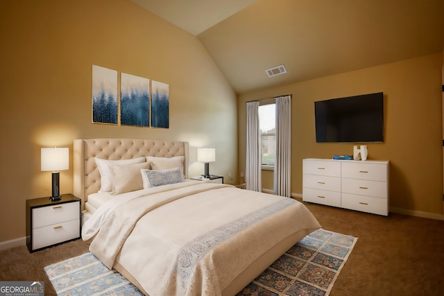 carpeted bedroom with vaulted ceiling