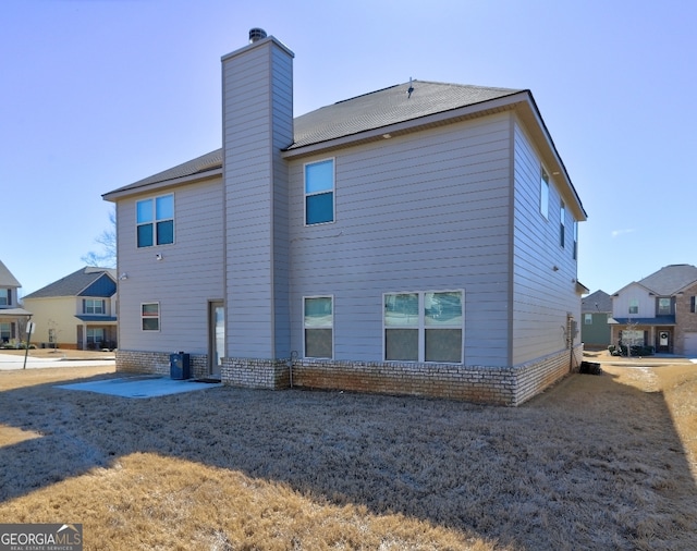 rear view of house featuring a patio area