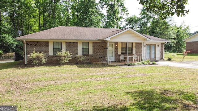 single story home with a front yard and a porch