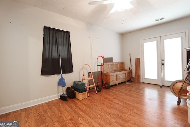 sitting room with ceiling fan, french doors, and light hardwood / wood-style floors