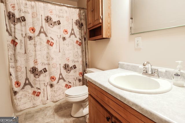 bathroom featuring vanity, toilet, and a shower with shower curtain