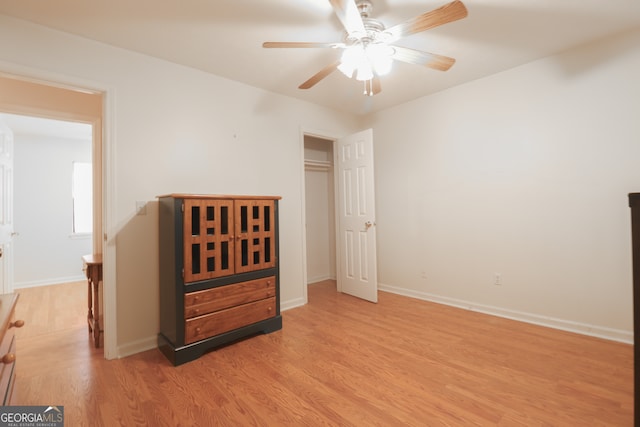 bedroom featuring light hardwood / wood-style flooring and ceiling fan