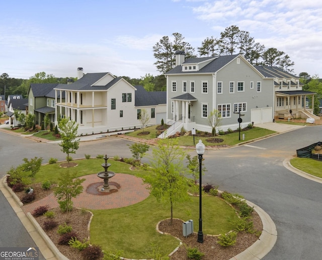 view of front of home featuring a garage and a front lawn