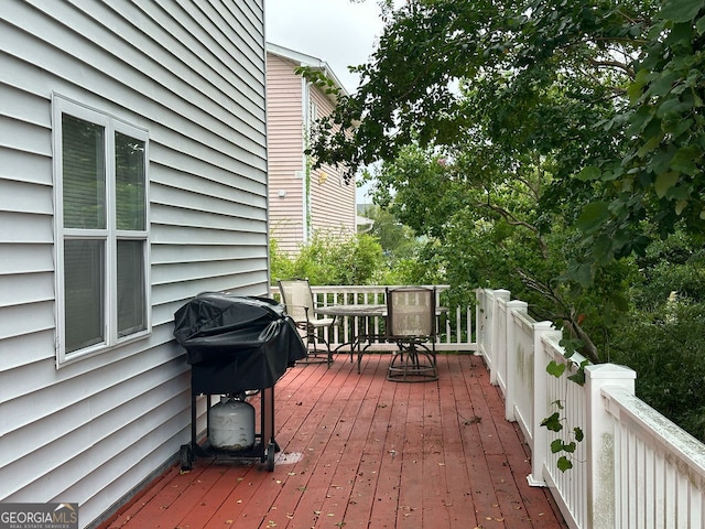 wooden terrace with area for grilling