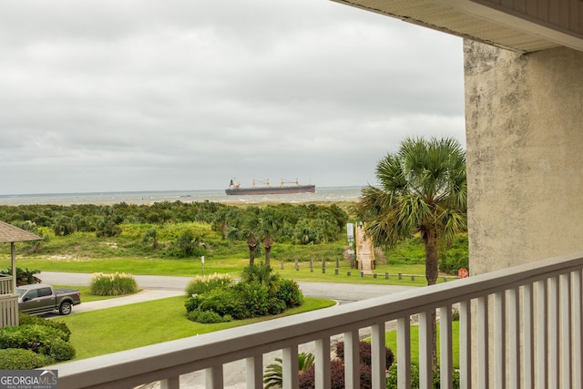 balcony featuring a water view