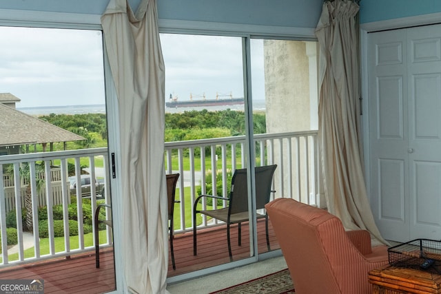 balcony featuring a water view