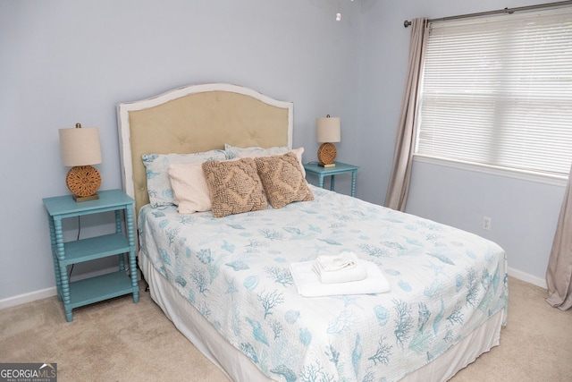 bedroom featuring light carpet