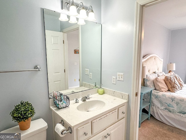 bathroom featuring vanity and toilet