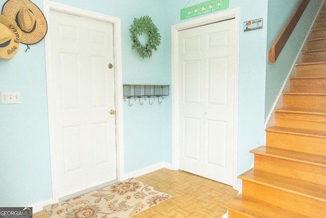 entryway featuring parquet floors