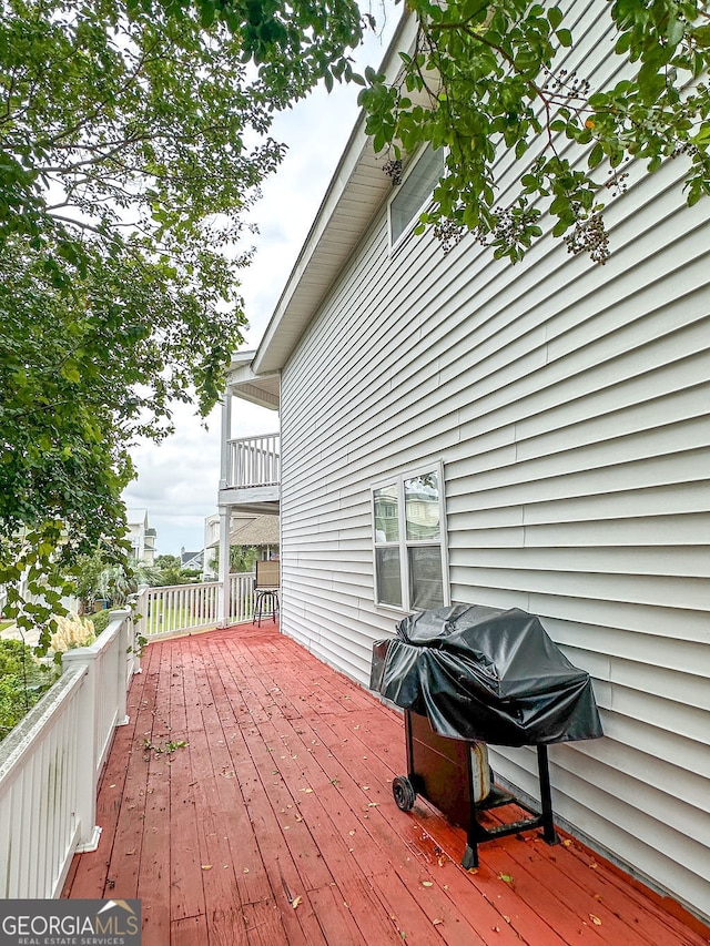 wooden deck featuring grilling area