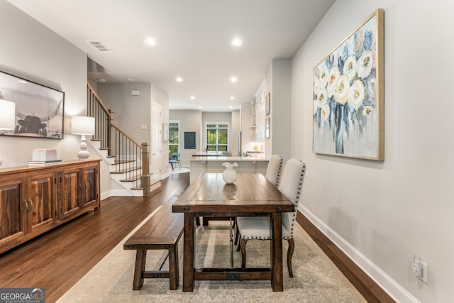 dining area with dark hardwood / wood-style floors