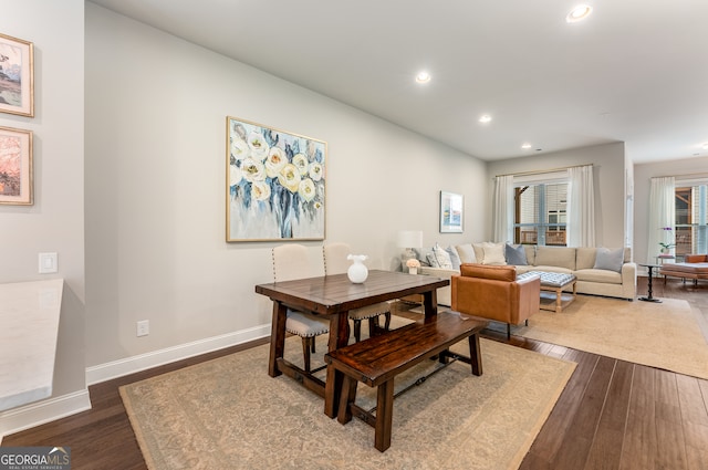 dining room with dark hardwood / wood-style floors