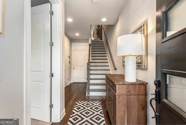 foyer entrance with dark wood-type flooring