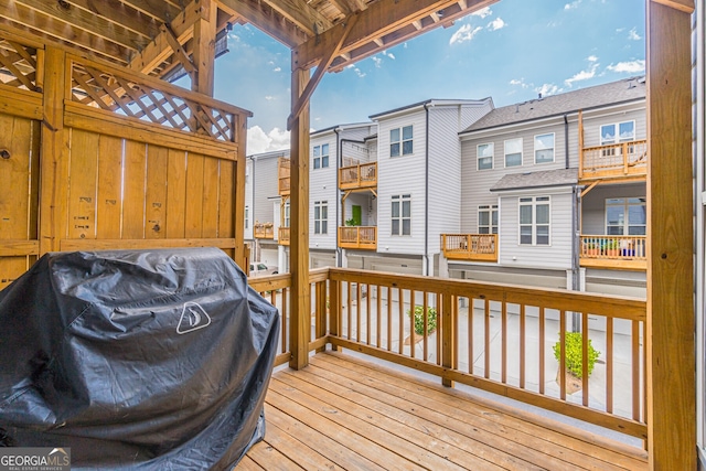 wooden terrace featuring grilling area